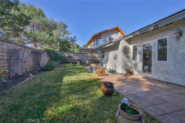 view of yard with a fenced backyard and a patio area