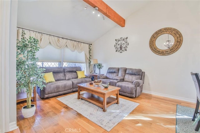 living area with vaulted ceiling with beams, baseboards, wood finished floors, and a notable chandelier