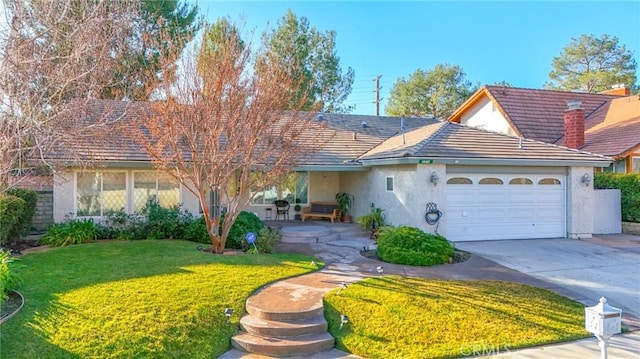 ranch-style home featuring a tile roof, a garage, stucco siding, a front yard, and driveway