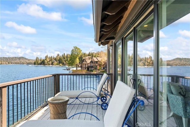 balcony featuring a water view