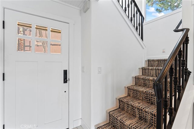 stairway featuring baseboards