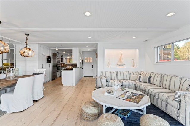 living room featuring recessed lighting and light wood-style flooring
