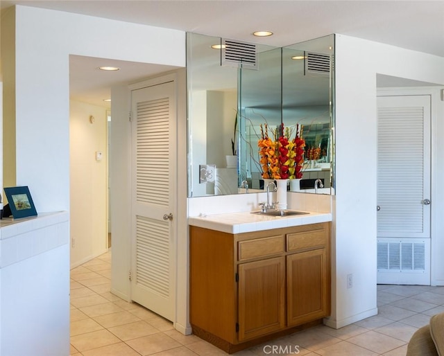 bathroom with vanity, tile patterned flooring, and visible vents