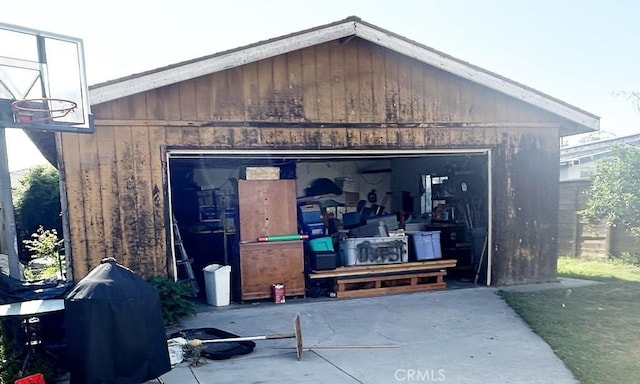 exterior space with an outdoor structure and a garage