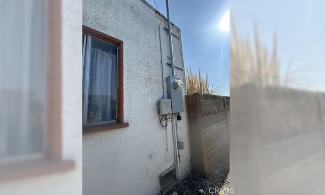 view of side of property with stucco siding