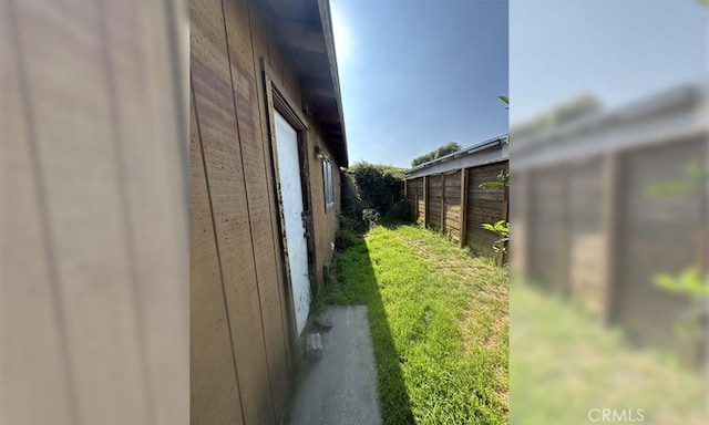 view of home's exterior with fence