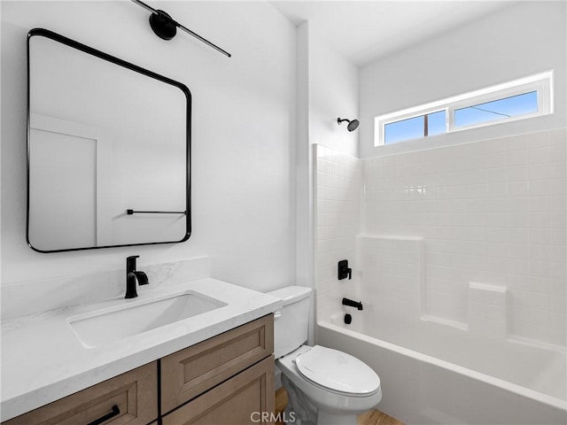 bathroom with shower / bath combination, vanity, and toilet