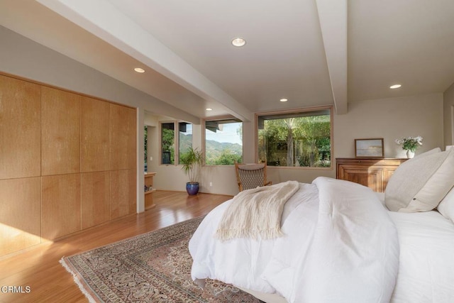 bedroom featuring light wood finished floors and recessed lighting