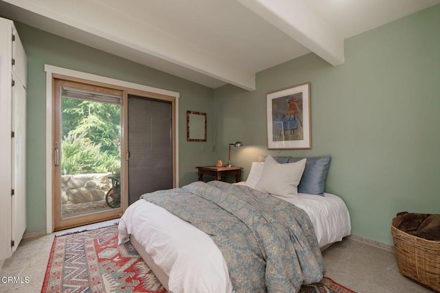 bedroom with access to exterior and baseboards