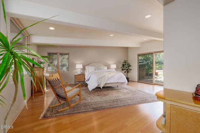 bedroom with access to outside, wood finished floors, recessed lighting, and beamed ceiling