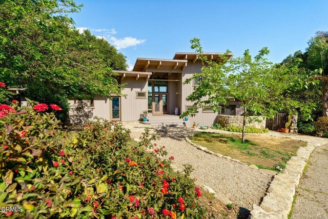 back of property featuring fence