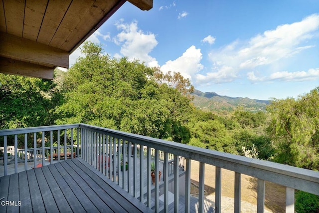 wooden deck with a mountain view