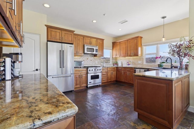944 Rainbow Crest Rd, Fallbrook, CA 92028 - kitchen featuring high quality appliances, a sink, brown cabinets, light stone countertops, and recessed lighting