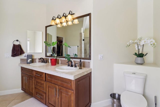 944 Rainbow Crest Rd, Fallbrook, CA 92028 - full bathroom featuring double vanity, toilet, baseboards, and tile patterned floors