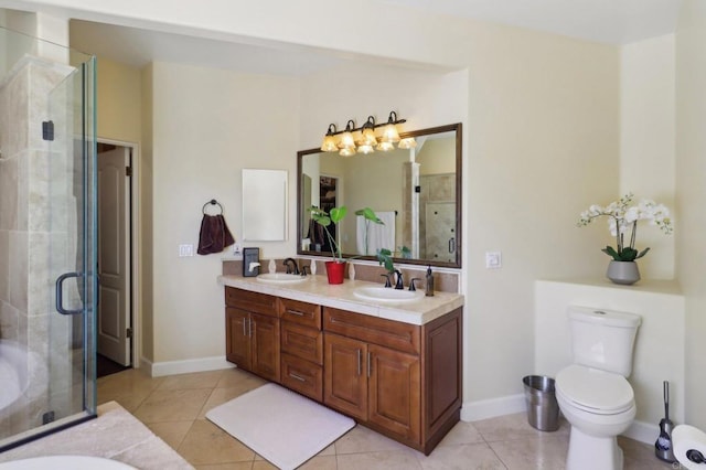 944 Rainbow Crest Rd, Fallbrook, CA 92028 - bathroom featuring tile patterned floors, a stall shower, double vanity, baseboards, and toilet