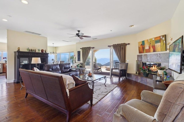 944 Rainbow Crest Rd, Fallbrook, CA 92028 - living room with ceiling fan, hardwood / wood-style floors, a tiled fireplace, recessed lighting, and a mountain view