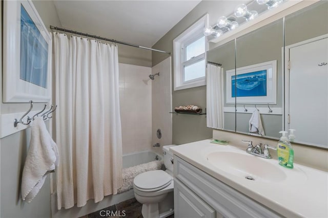 full bathroom with shower / tub combo, toilet, and vanity