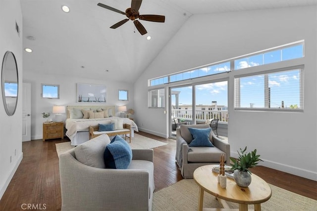 living area with ceiling fan, high vaulted ceiling, recessed lighting, baseboards, and wood finished floors