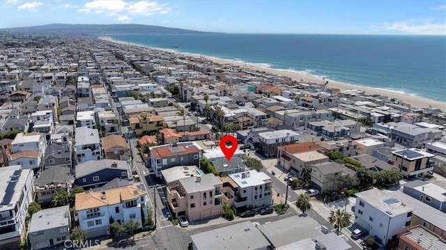 bird's eye view with a water view, a residential view, and a view of the beach