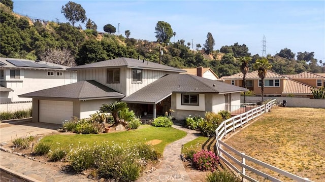 1430 Caballo Ranch Rd, San Dimas, CA 91773 - view of front of house with an attached garage, fence, driveway, and a front lawn