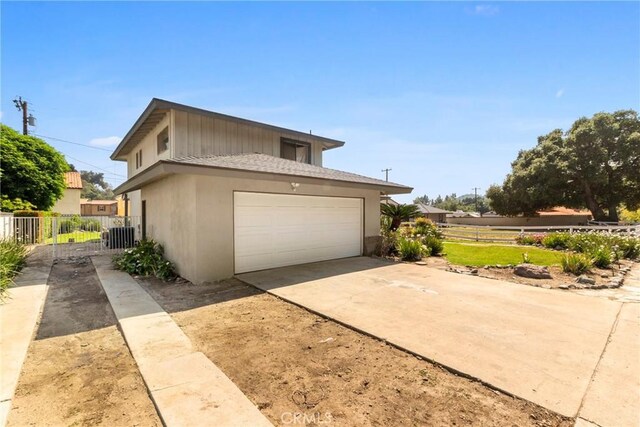 1430 Caballo Ranch Rd, San Dimas, CA 91773 - view of home's exterior with fence, stucco siding, and concrete driveway