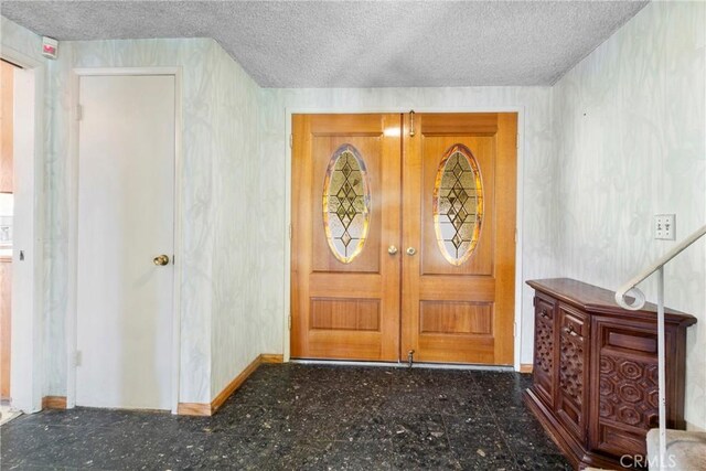 1430 Caballo Ranch Rd, San Dimas, CA 91773 - foyer entrance featuring a textured ceiling and baseboards