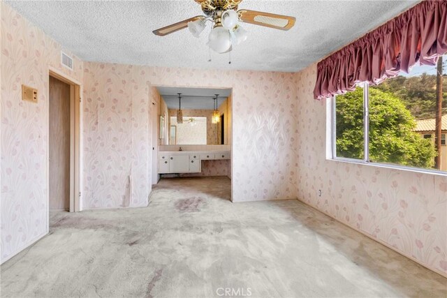 1430 Caballo Ranch Rd, San Dimas, CA 91773 - interior space featuring a ceiling fan, a textured ceiling, visible vents, and wallpapered walls