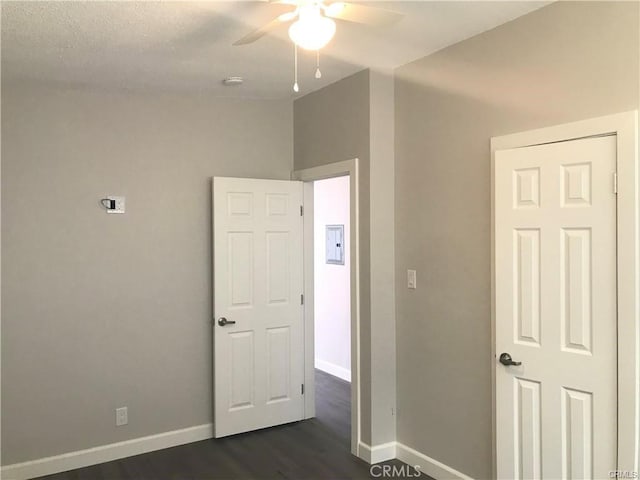 539 E 223rd St, Carson, CA 90745 - empty room with a ceiling fan, dark wood-type flooring, electric panel, and a smoke detector