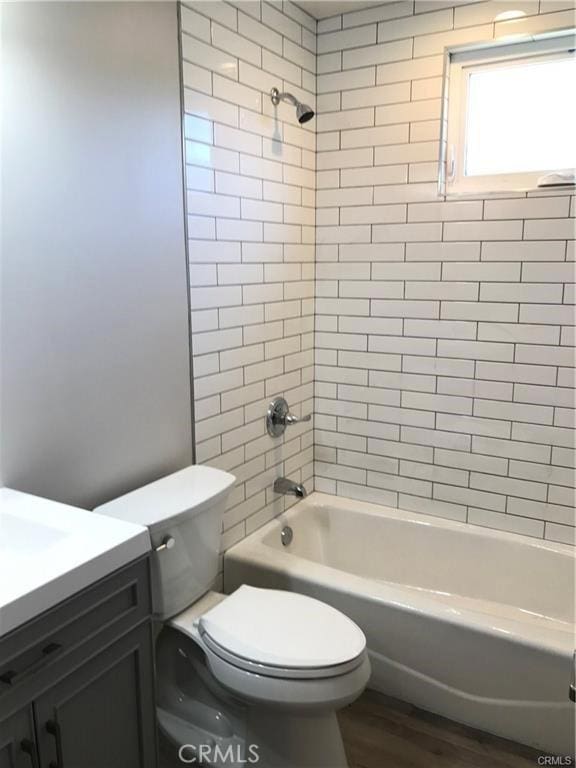539 E 223rd St, Carson, CA 90745 - bathroom with toilet, bathing tub / shower combination, vanity, and wood finished floors