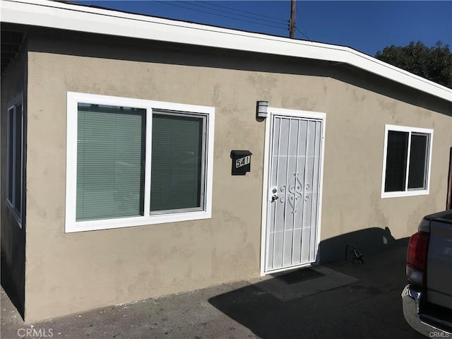 539 E 223rd St, Carson, CA 90745 - doorway to property featuring stucco siding