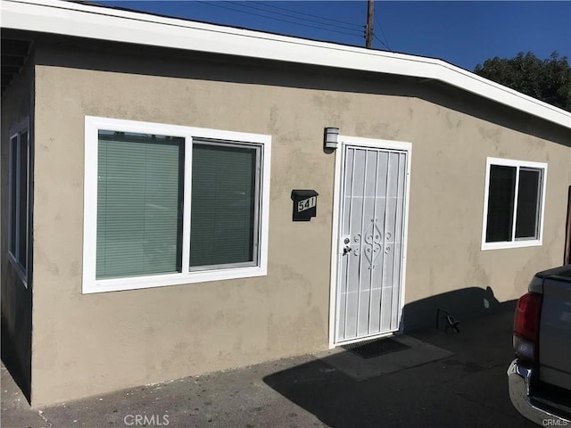 539 E 223rd St, Carson, CA 90745 - view of exterior entry featuring stucco siding