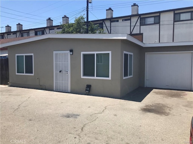 539 E 223rd St, Carson, CA 90745 - back of house featuring stucco siding and driveway