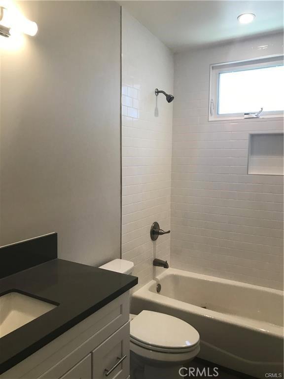 539 E 223rd St, Carson, CA 90745 - full bathroom with vanity, toilet, and shower / washtub combination