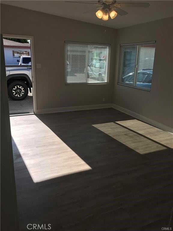539 E 223rd St, Carson, CA 90745 - spare room featuring a ceiling fan, wood finished floors, and baseboards