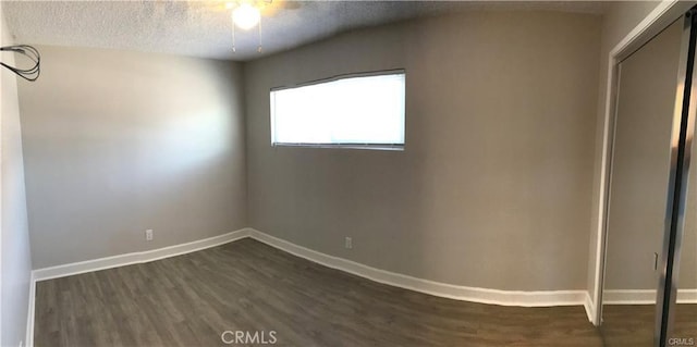 539 E 223rd St, Carson, CA 90745 - empty room with dark wood-style floors, a textured ceiling, baseboards, and ceiling fan