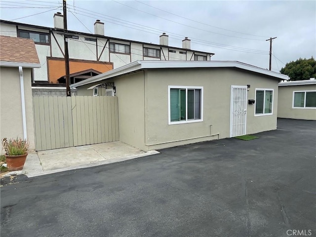 539 E 223rd St, Carson, CA 90745 - view of front of house featuring stucco siding and a chimney