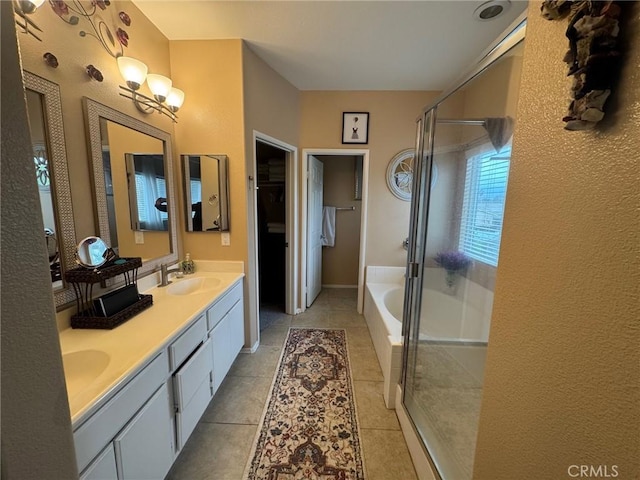 4605 Butterfield Way, Hemet, CA 92544 - full bathroom featuring a shower stall, a bath, double vanity, tile patterned flooring, and a walk in closet