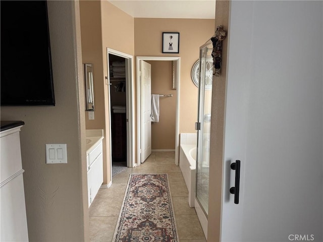 4605 Butterfield Way, Hemet, CA 92544 - full bathroom featuring vanity, a garden tub, tile patterned flooring, and a walk in closet