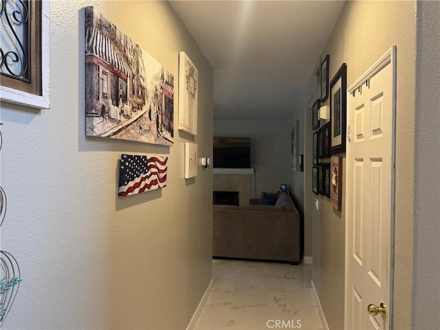 4605 Butterfield Way, Hemet, CA 92544 - hallway featuring light marble finish flooring and baseboards