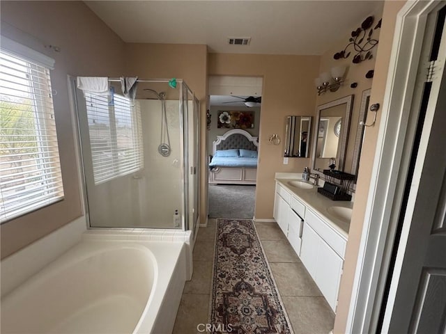ensuite bathroom featuring visible vents, ensuite bathroom, tile patterned floors, a sink, and a stall shower