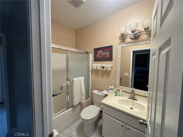 bathroom featuring visible vents, vanity, toilet, marble finish floor, and enclosed tub / shower combo