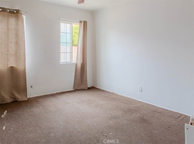 carpeted empty room with ceiling fan