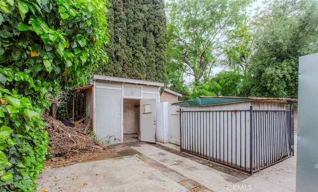 view of shed with fence