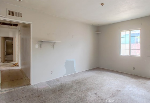 carpeted empty room with visible vents