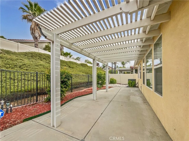 view of patio with a fenced backyard and a pergola