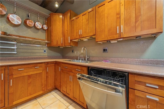 kitchen featuring a sink, brown cabinetry, light countertops, and dishwasher