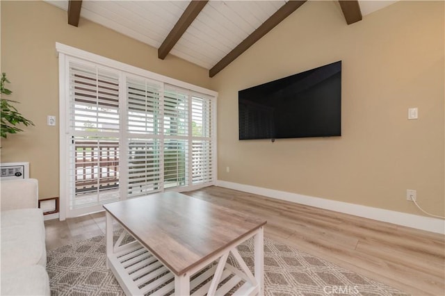 living room with baseboards, wood finished floors, and lofted ceiling with beams