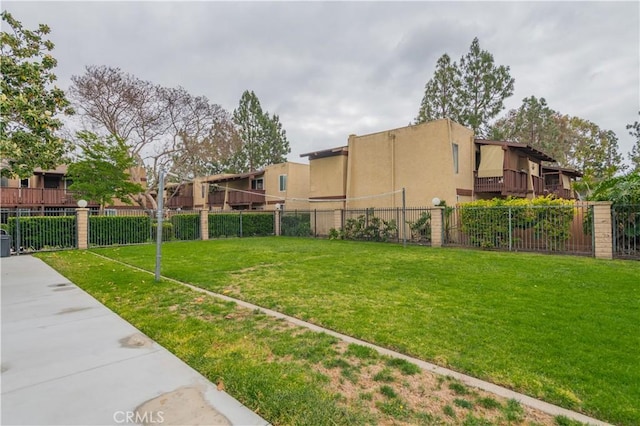 view of yard featuring fence and a residential view
