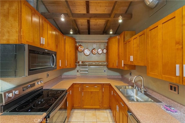 kitchen with wood ceiling, a sink, beam ceiling, stainless steel appliances, and light countertops