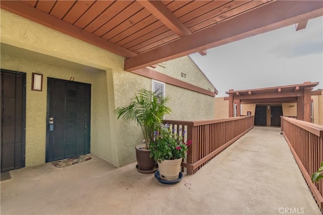doorway to property with stucco siding